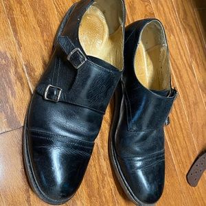 Women’s black monk shoes.